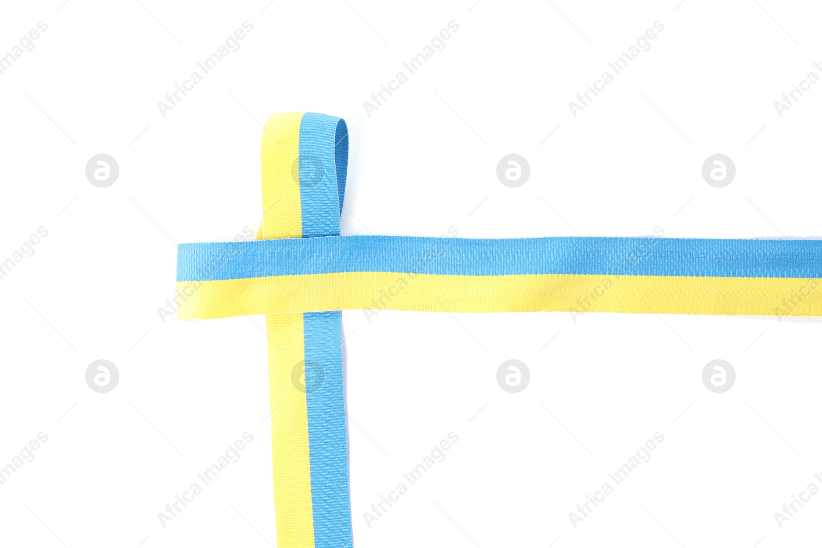 Photo of Ribbon in colors of Ukrainian national flag isolated on white, top view