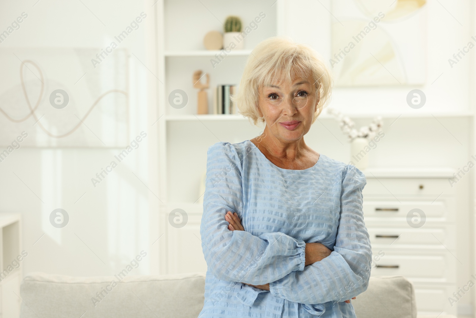 Photo of Portrait of beautiful senior woman at home, space for text