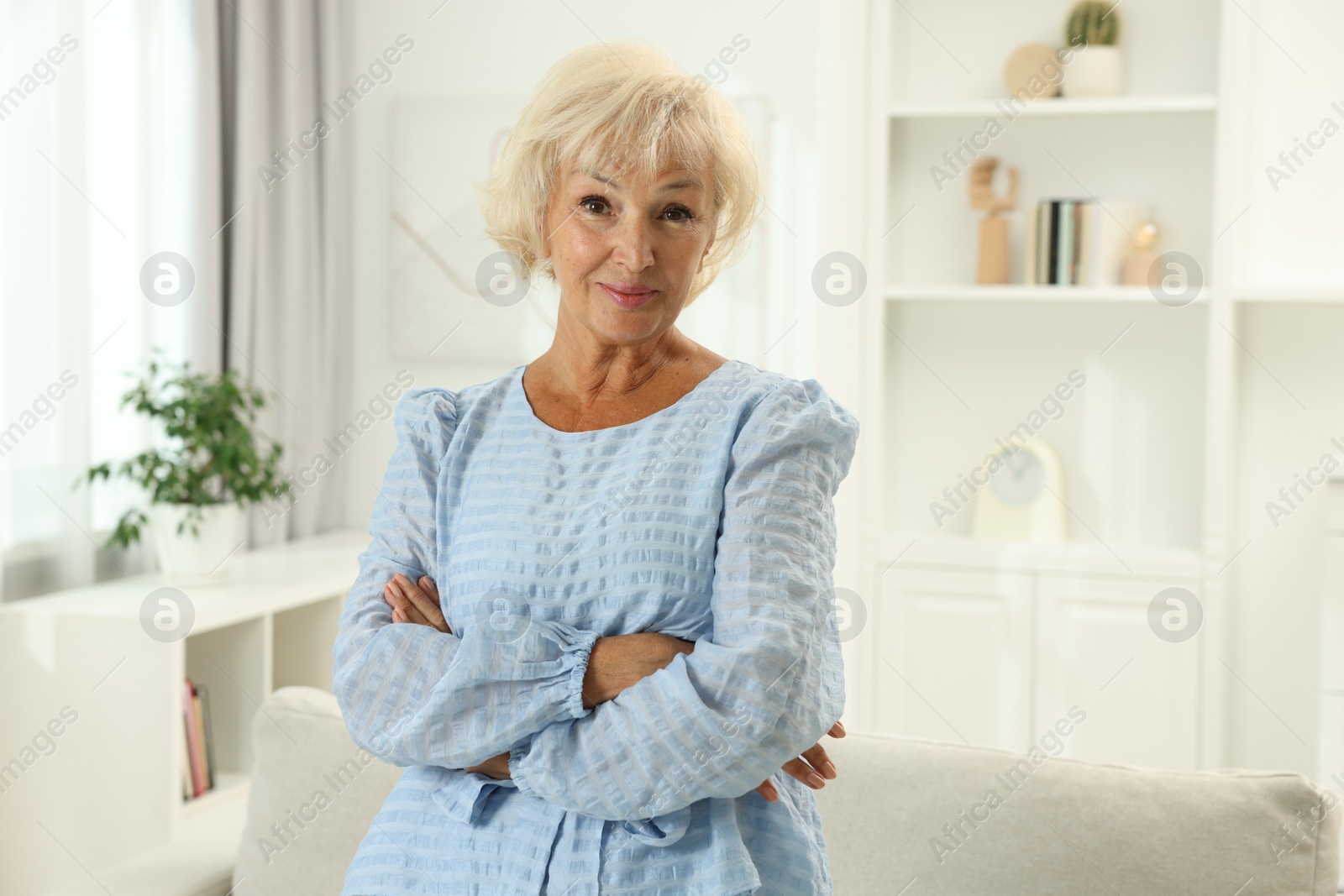 Photo of Portrait of beautiful senior woman at home, space for text