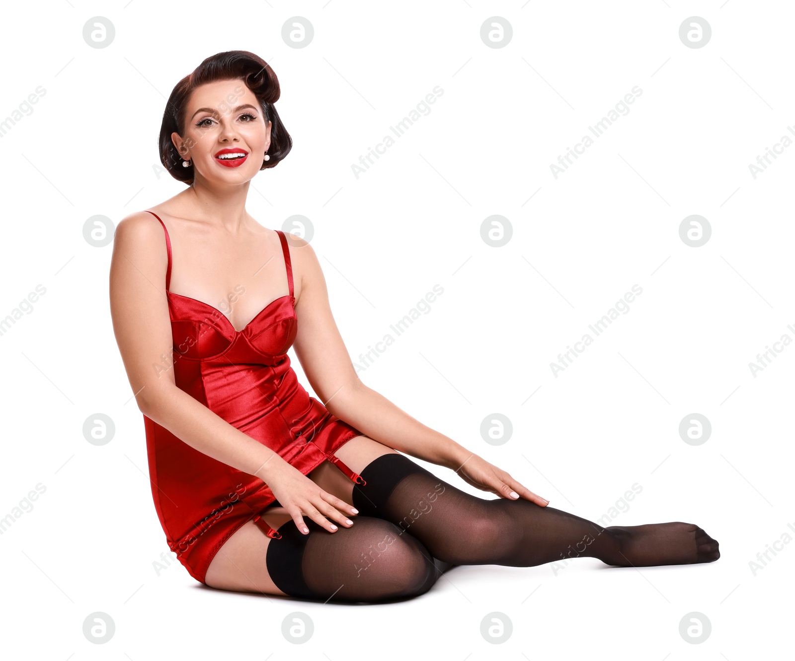 Photo of Pin-up woman in red underwear on white background