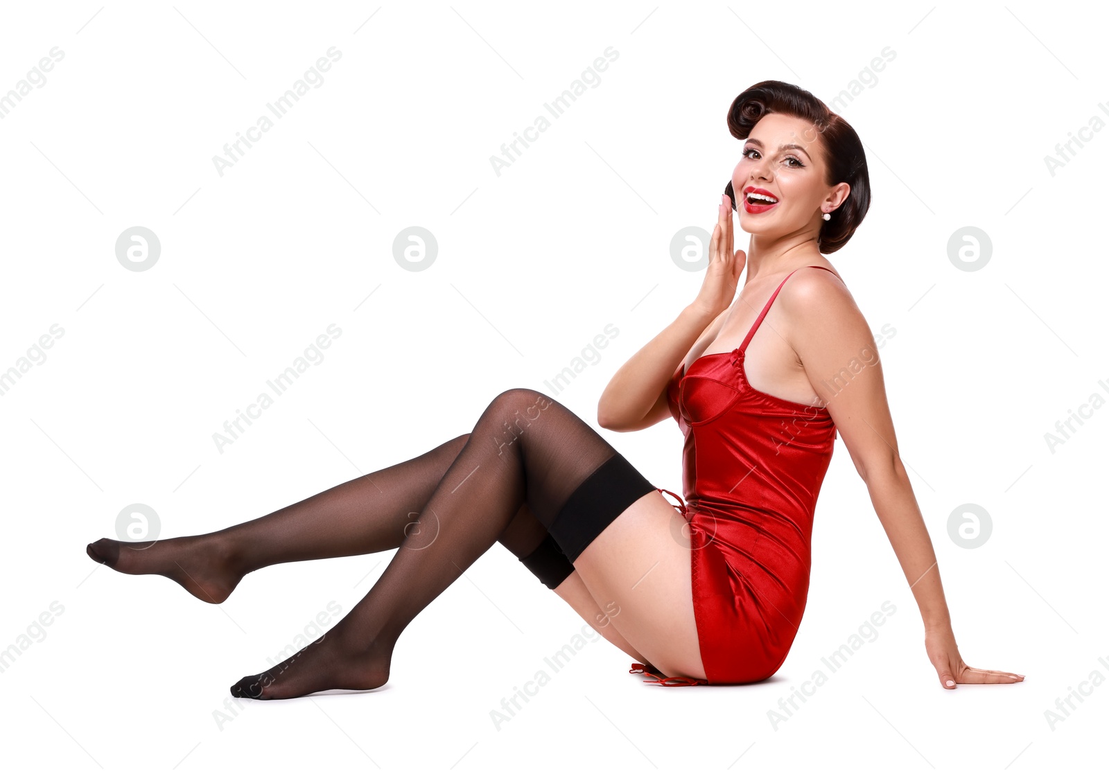 Photo of Pin-up woman in red underwear on white background