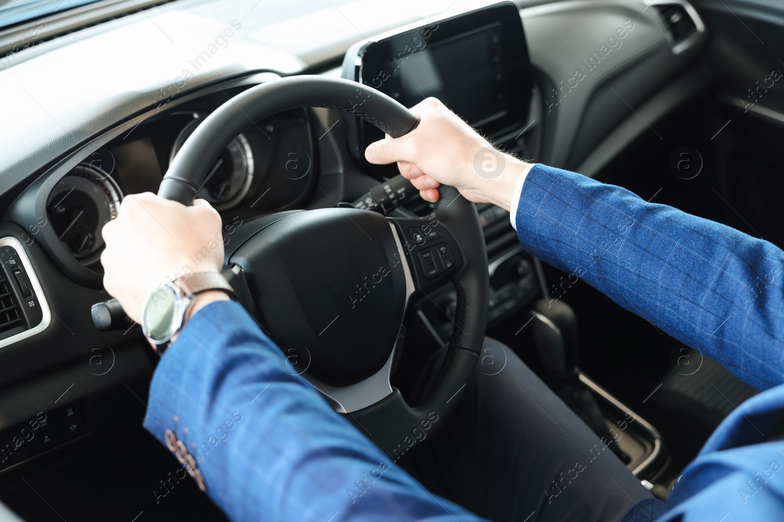 Photo of Man inside new car in salon, closeup