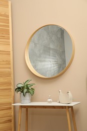 Mirror and storage bench in hallway. Interior design