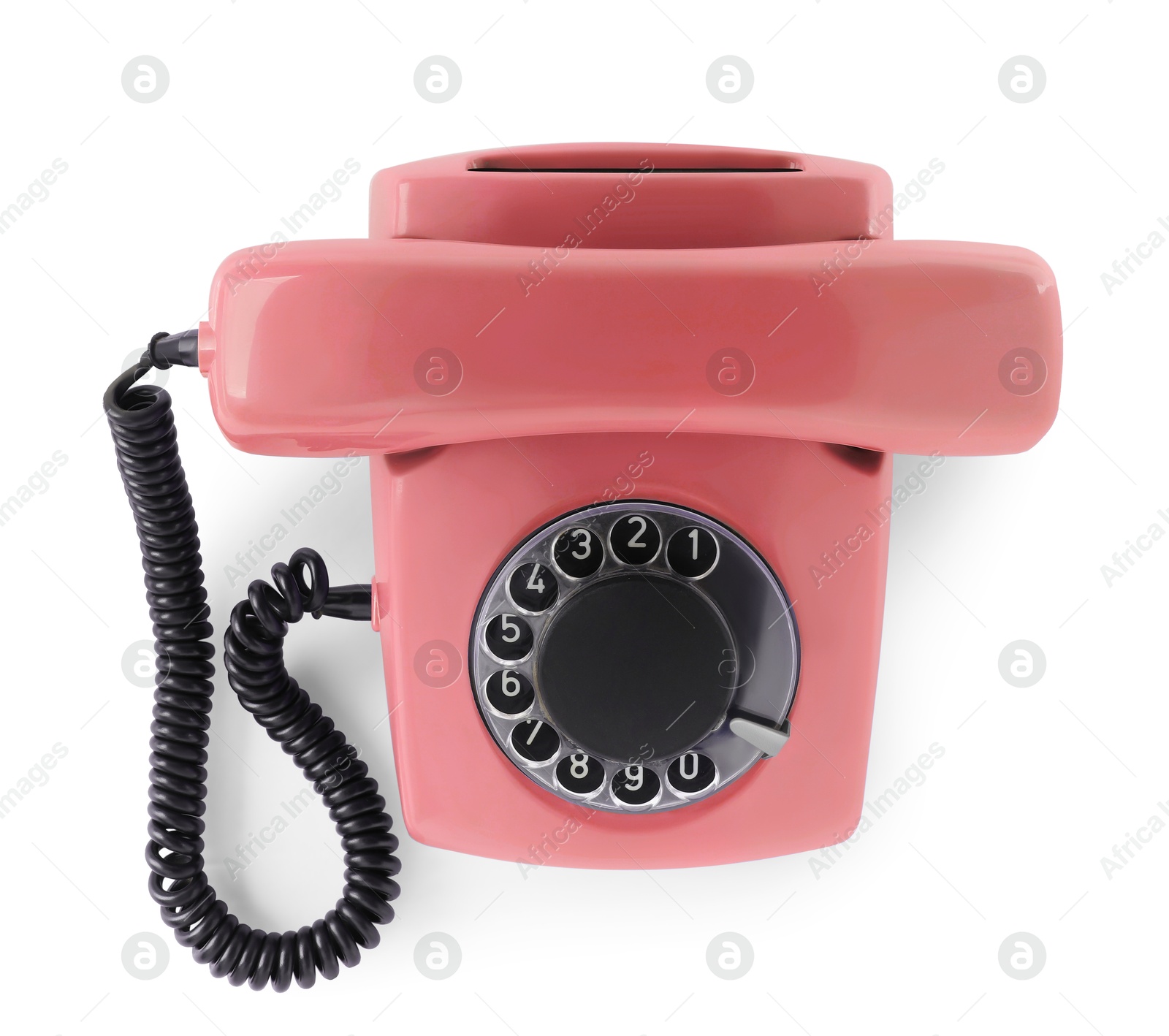 Image of Old coral color telephone with rotary dial isolated on white, top view