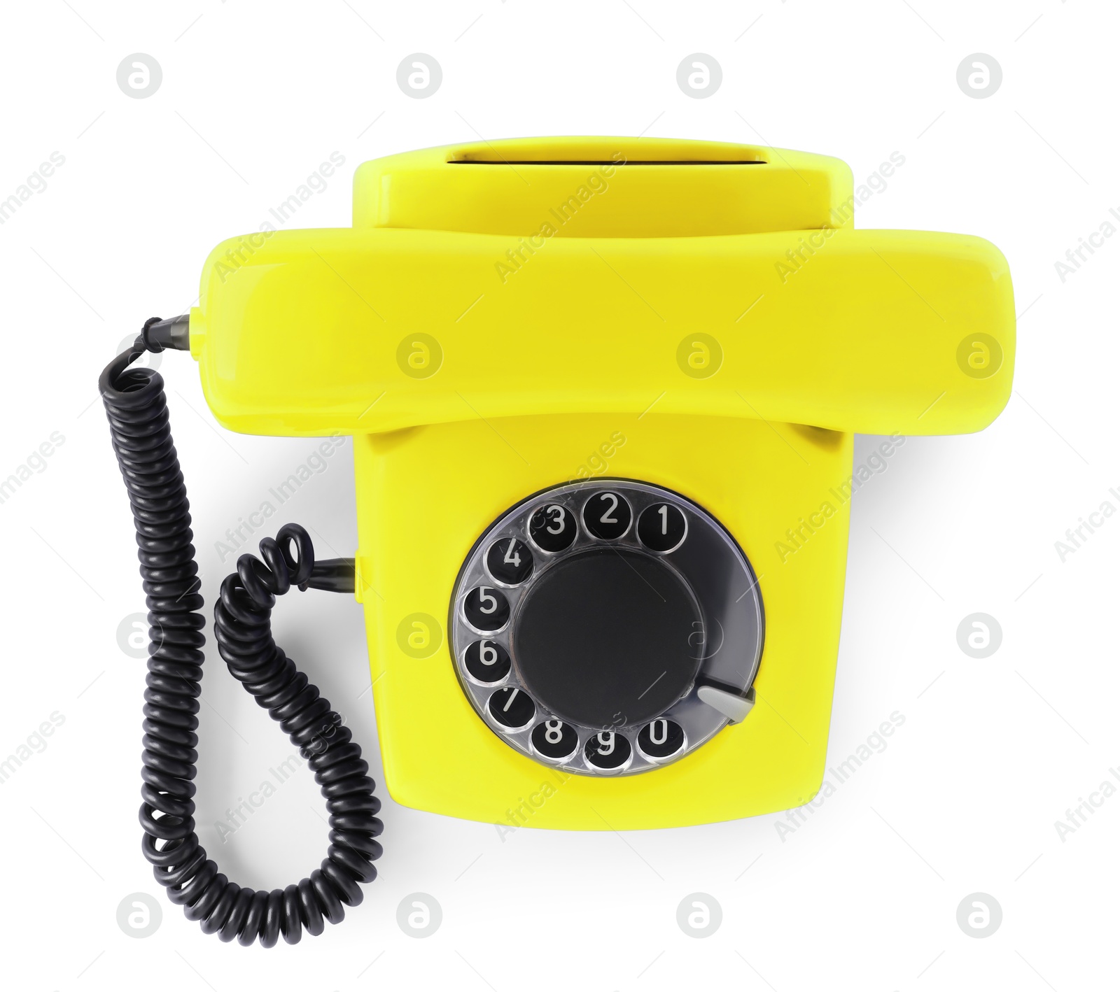 Image of Old yellow telephone with rotary dial isolated on white, top view