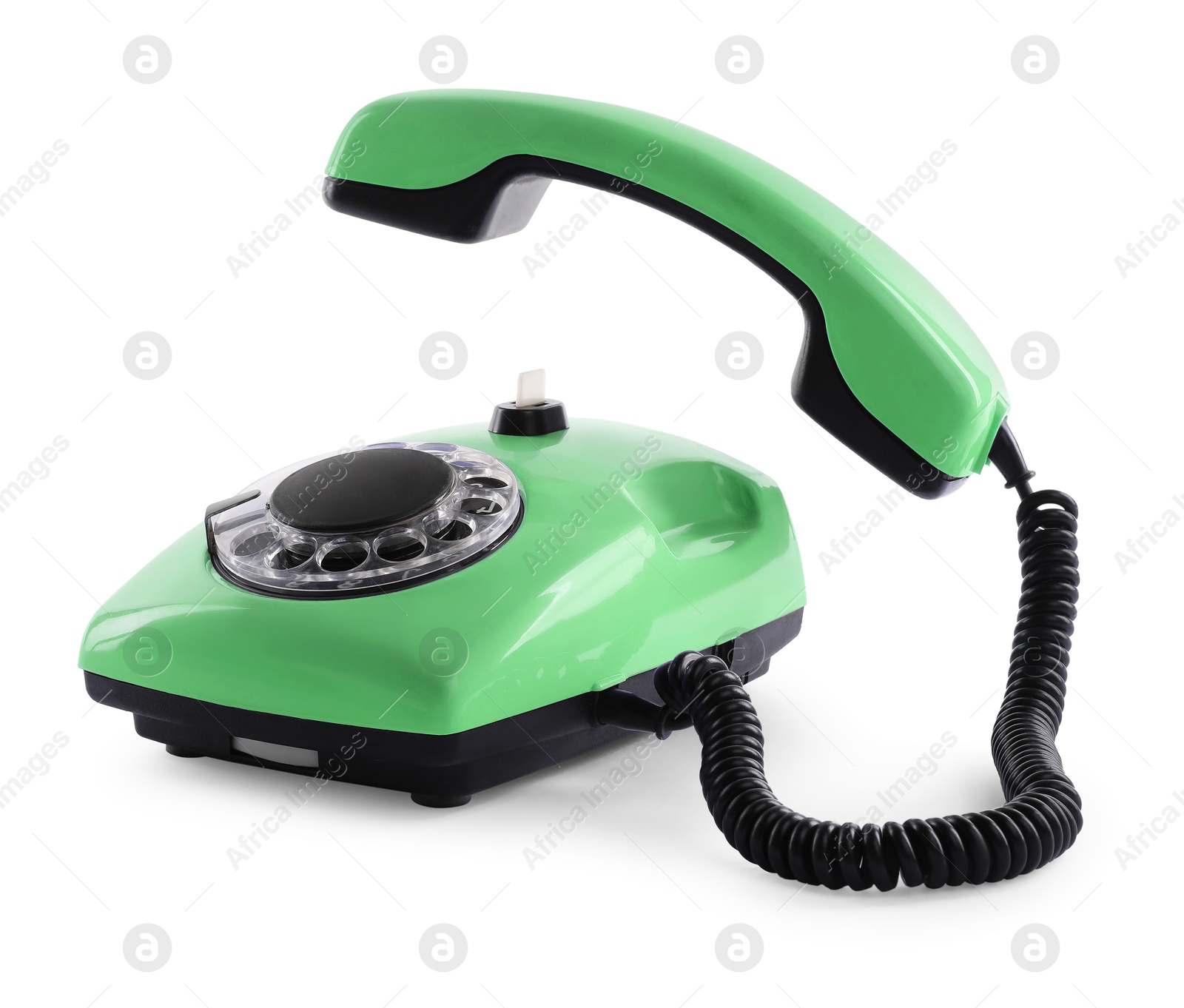 Image of Old light green telephone with rotary dial isolated on white