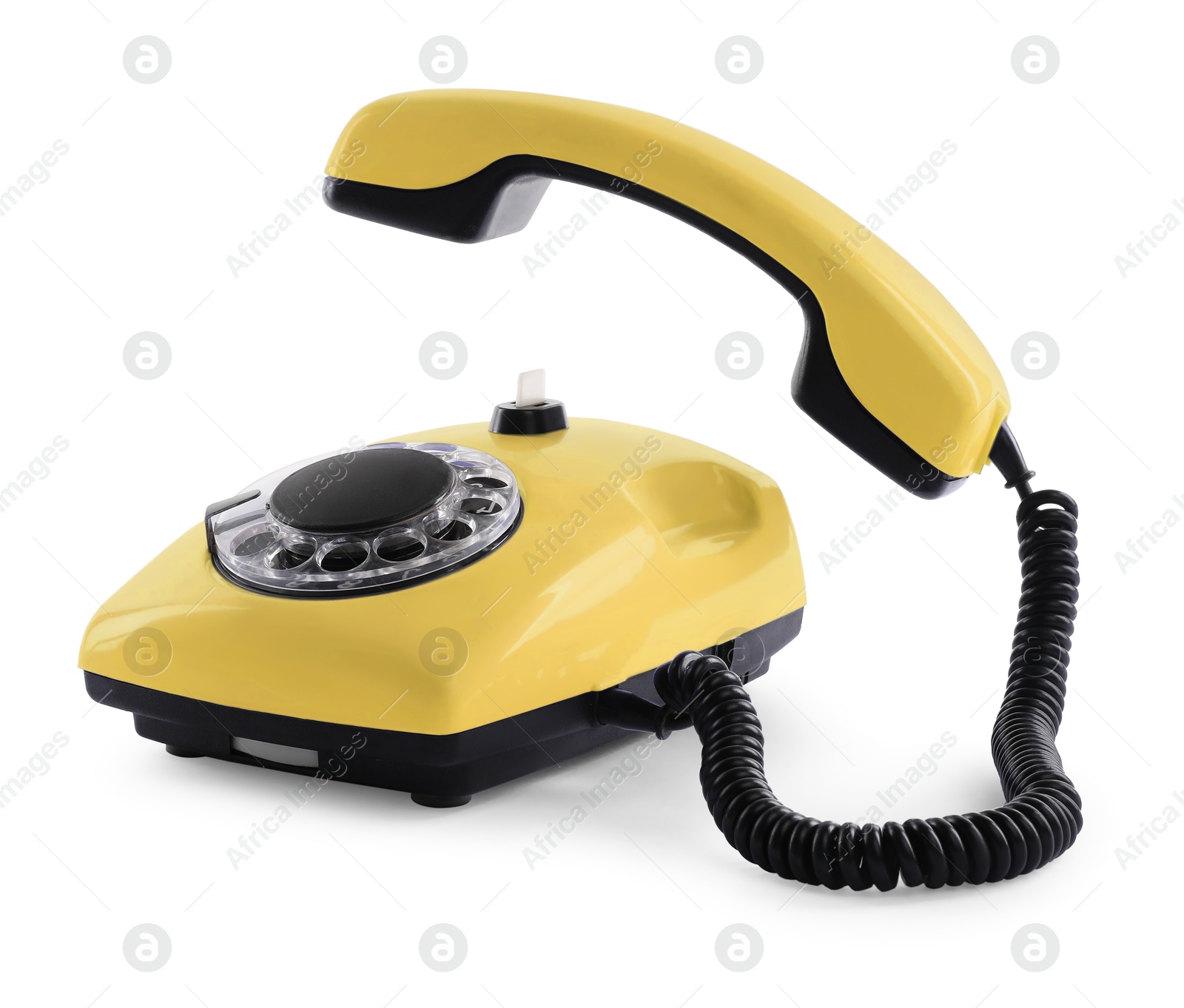 Image of Old yellow telephone with rotary dial isolated on white