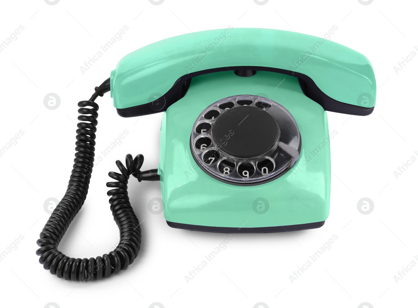 Image of Old aquamarine telephone with rotary dial isolated on white