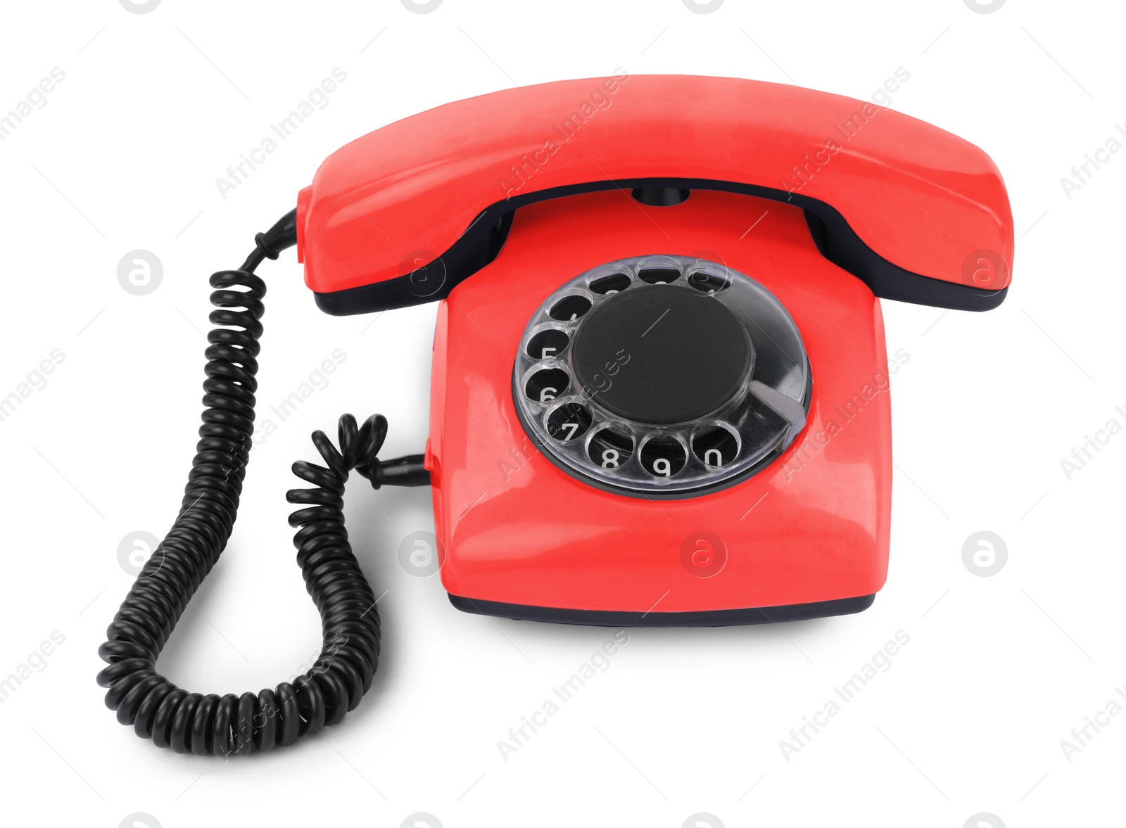 Image of Old red telephone with rotary dial isolated on white