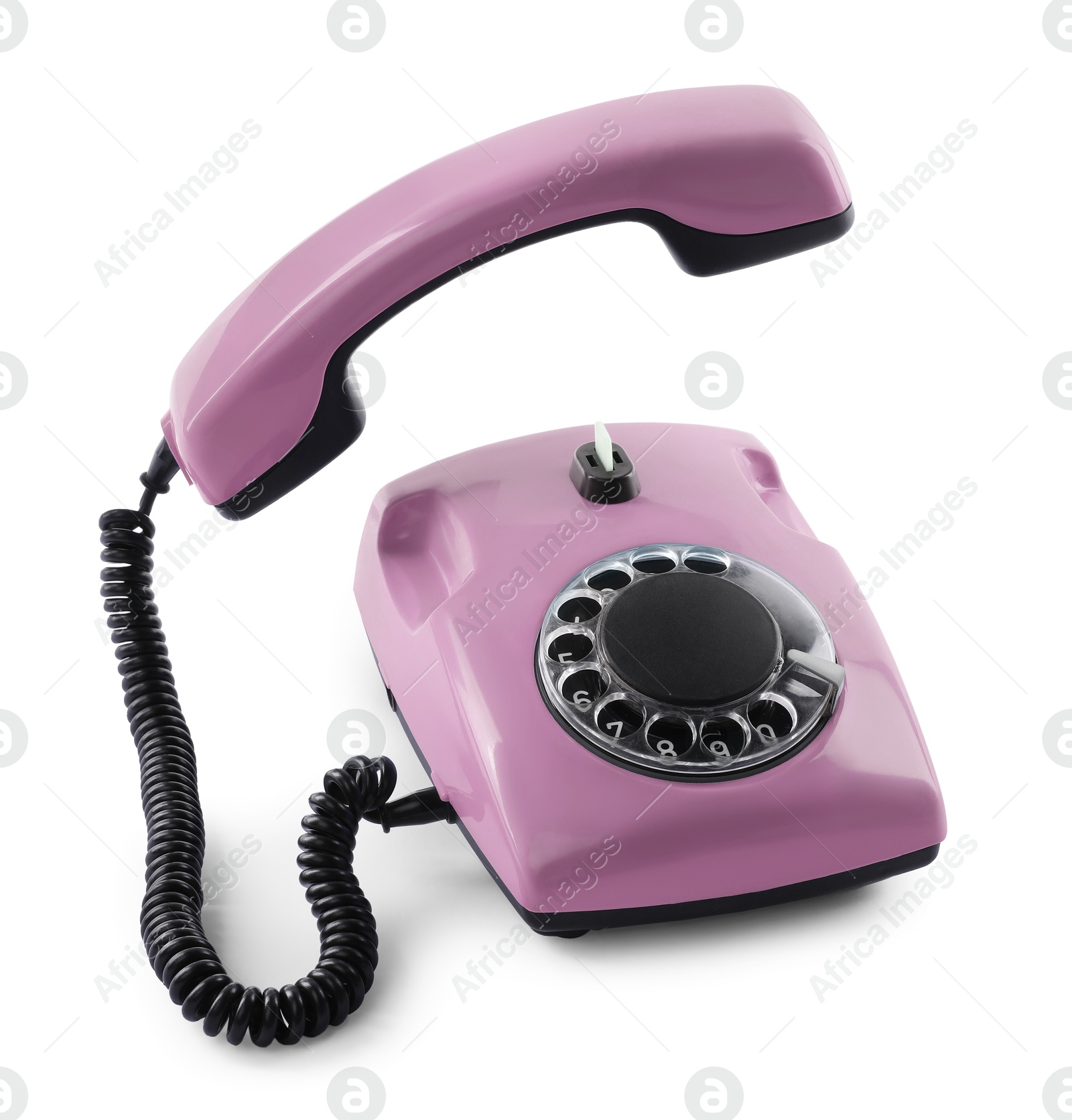 Image of Old pink telephone with rotary dial isolated on white