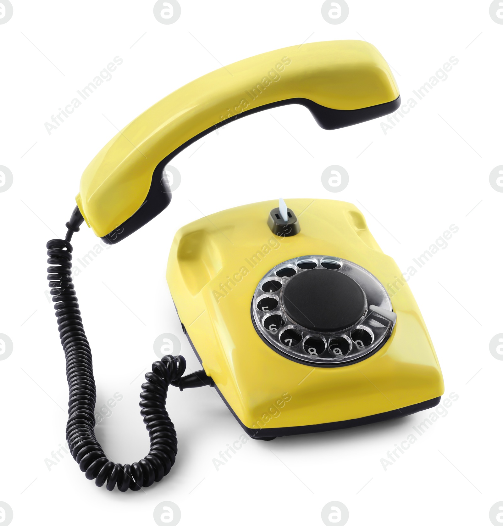 Image of Old yellow telephone with rotary dial isolated on white