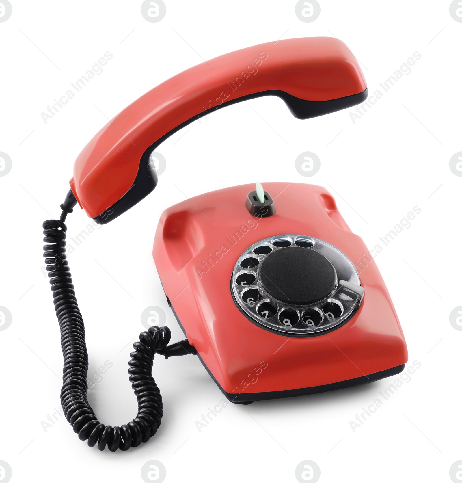 Image of Old red telephone with rotary dial isolated on white