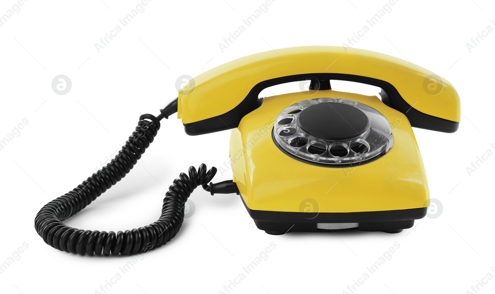 Image of Old yellow telephone with rotary dial isolated on white