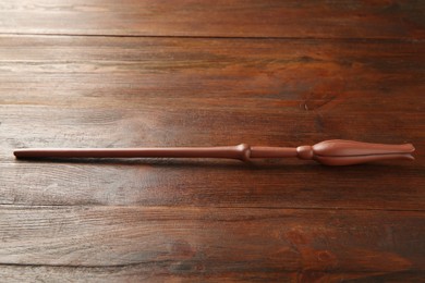 Photo of One old magic wand on wooden table