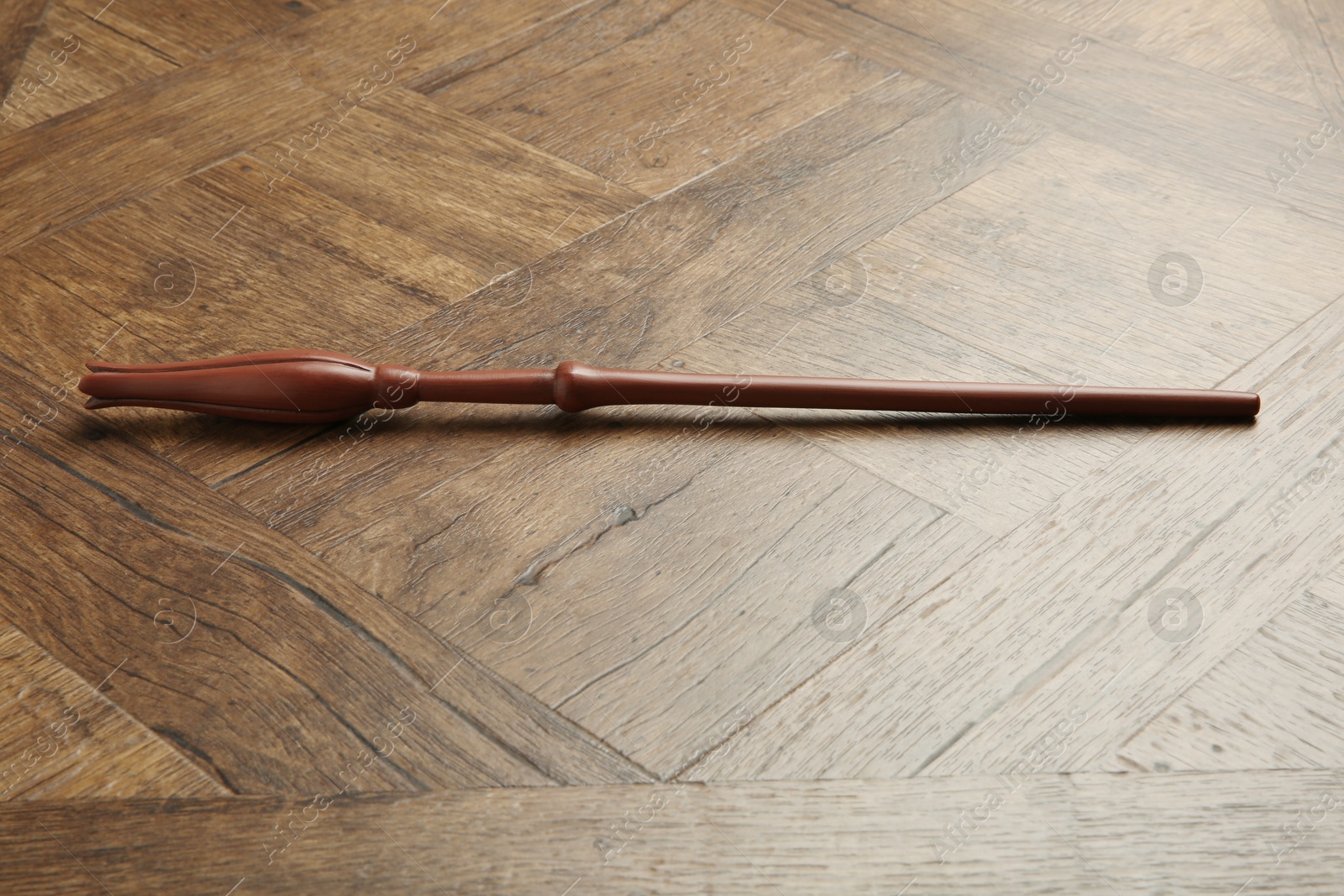 Photo of One old magic wand on wooden table