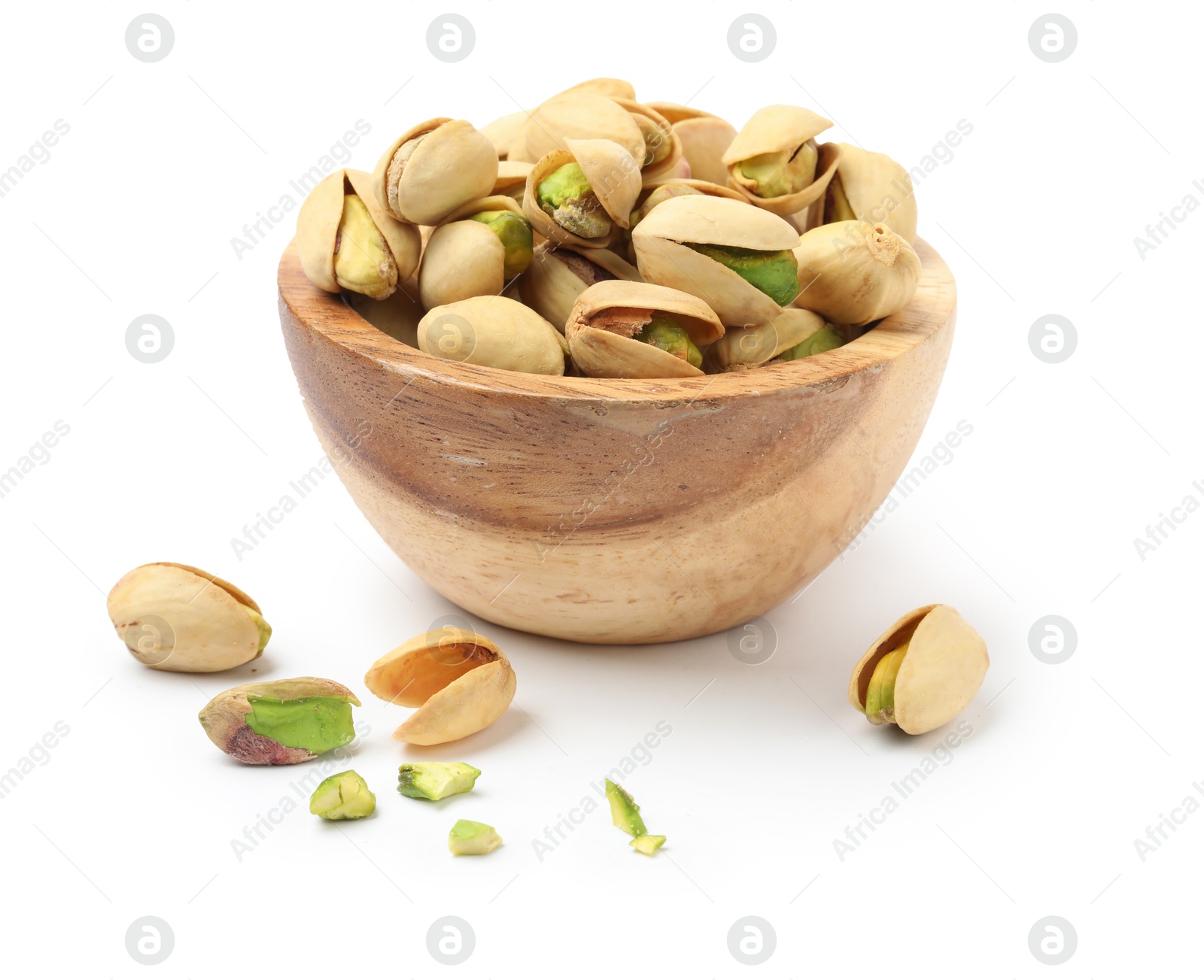 Photo of Tasty pistachio nuts in bowl isolated on white