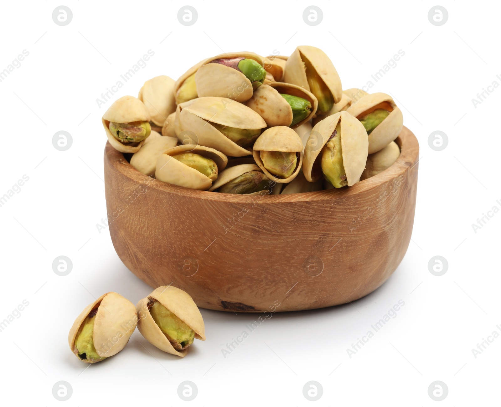 Photo of Tasty pistachio nuts in bowl isolated on white