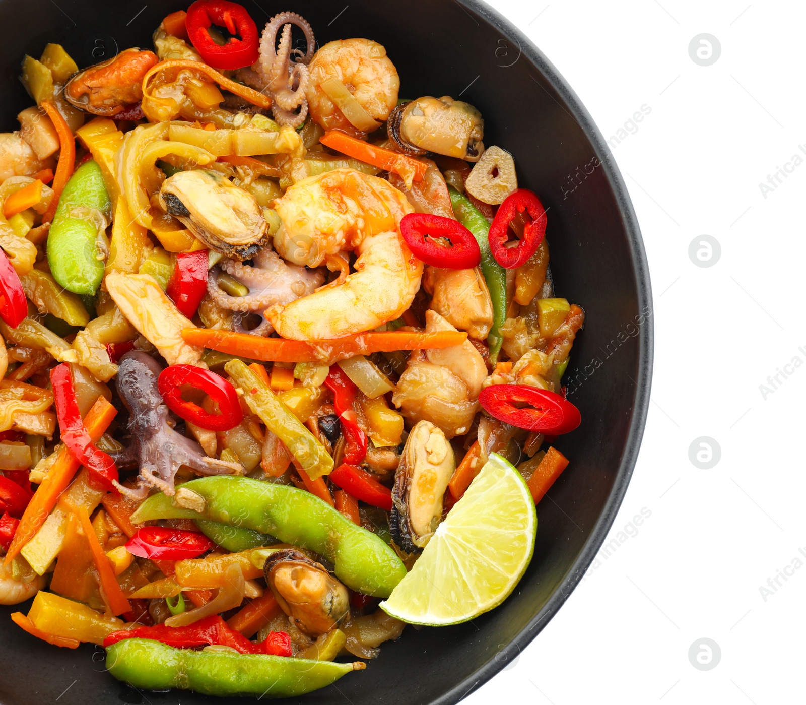 Photo of Stir-fry sea food in bowl isolated on white, top view