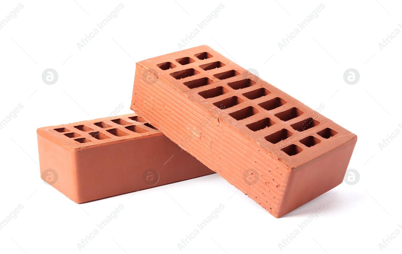 Photo of Red bricks isolated on white. Building material