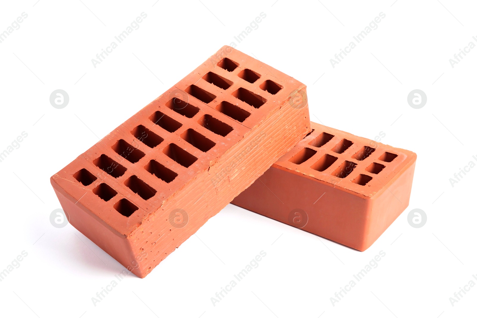 Photo of Red bricks isolated on white. Building material