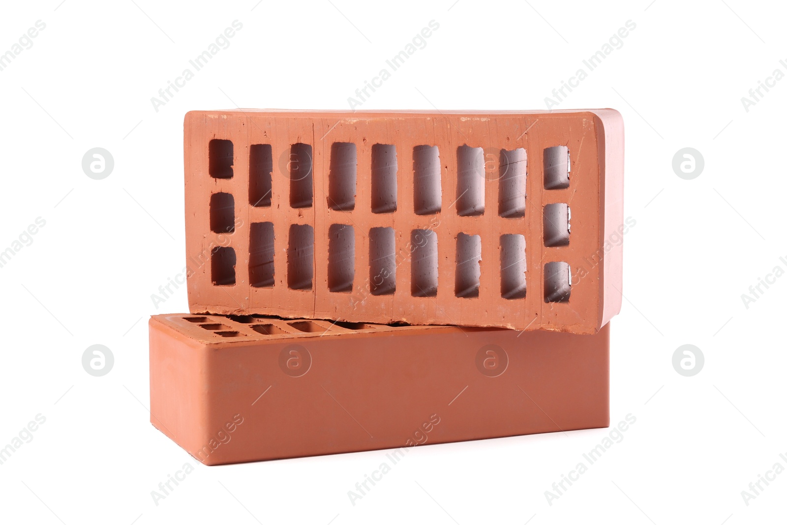 Photo of Red bricks isolated on white. Building material