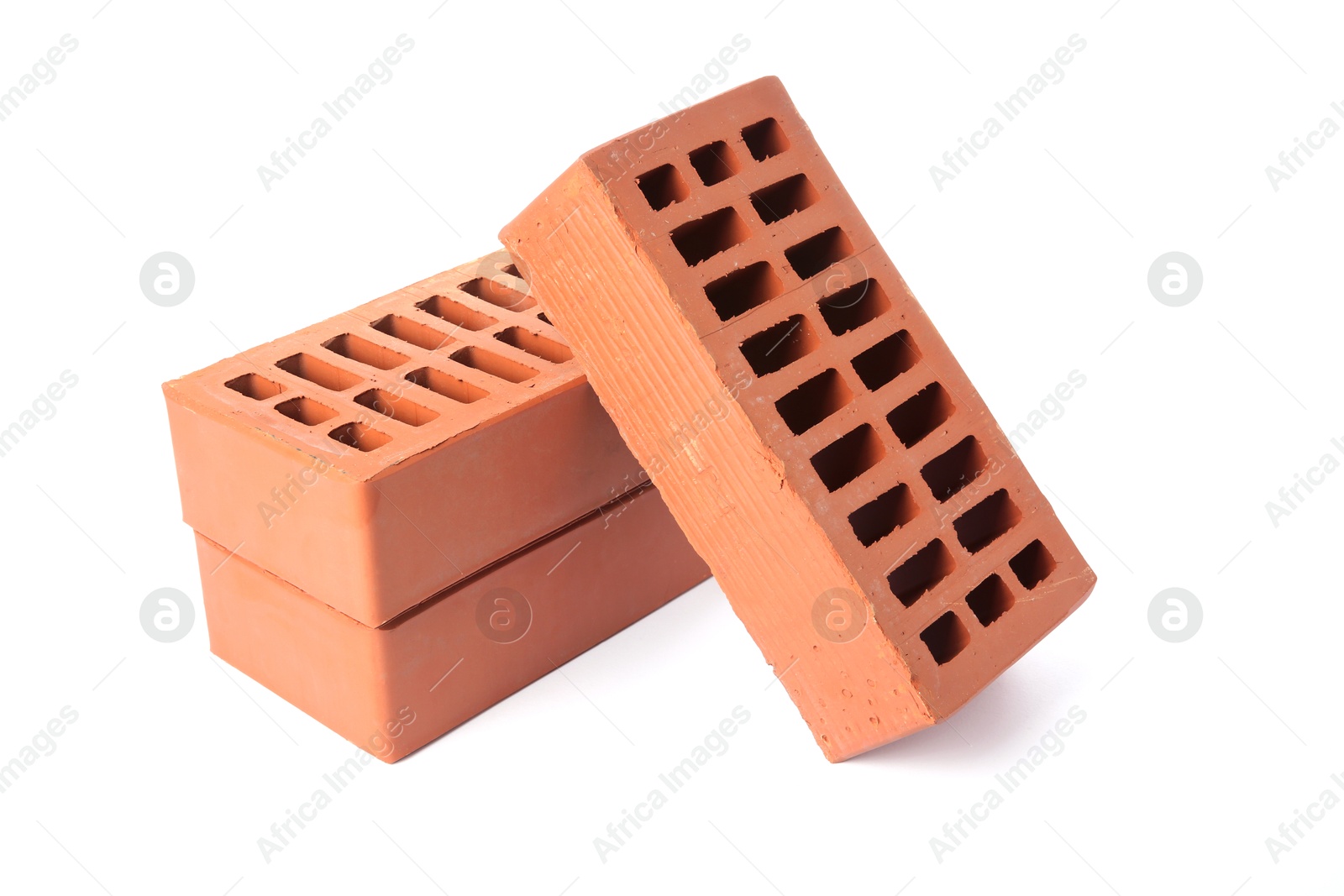 Photo of Red bricks isolated on white. Building material