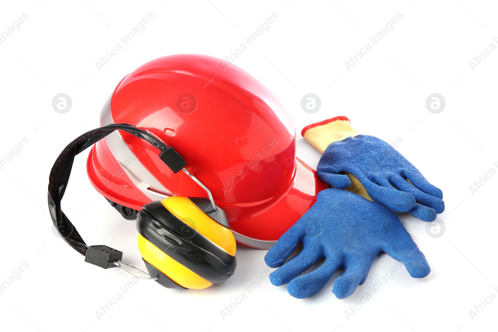 Photo of Orange hard hat, gloves and earmuffs isolated on white. Safety equipment