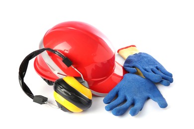 Orange hard hat, gloves and earmuffs isolated on white. Safety equipment