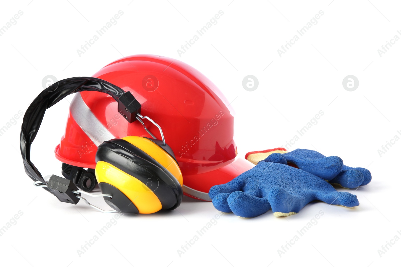 Photo of Orange hard hat, gloves and earmuffs isolated on white. Safety equipment