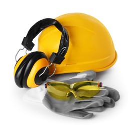 Photo of Yellow hard hat, earmuffs, gloves and goggles isolated on white. Safety equipment