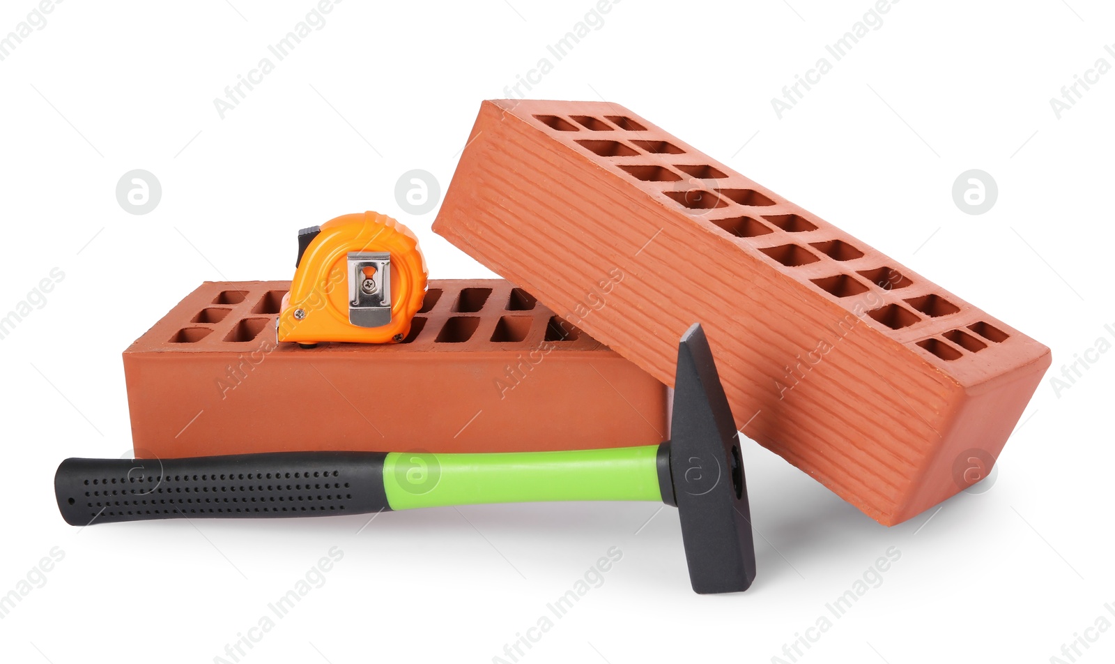 Photo of Hammer, measuring tape and red bricks isolated on white. Construction tools