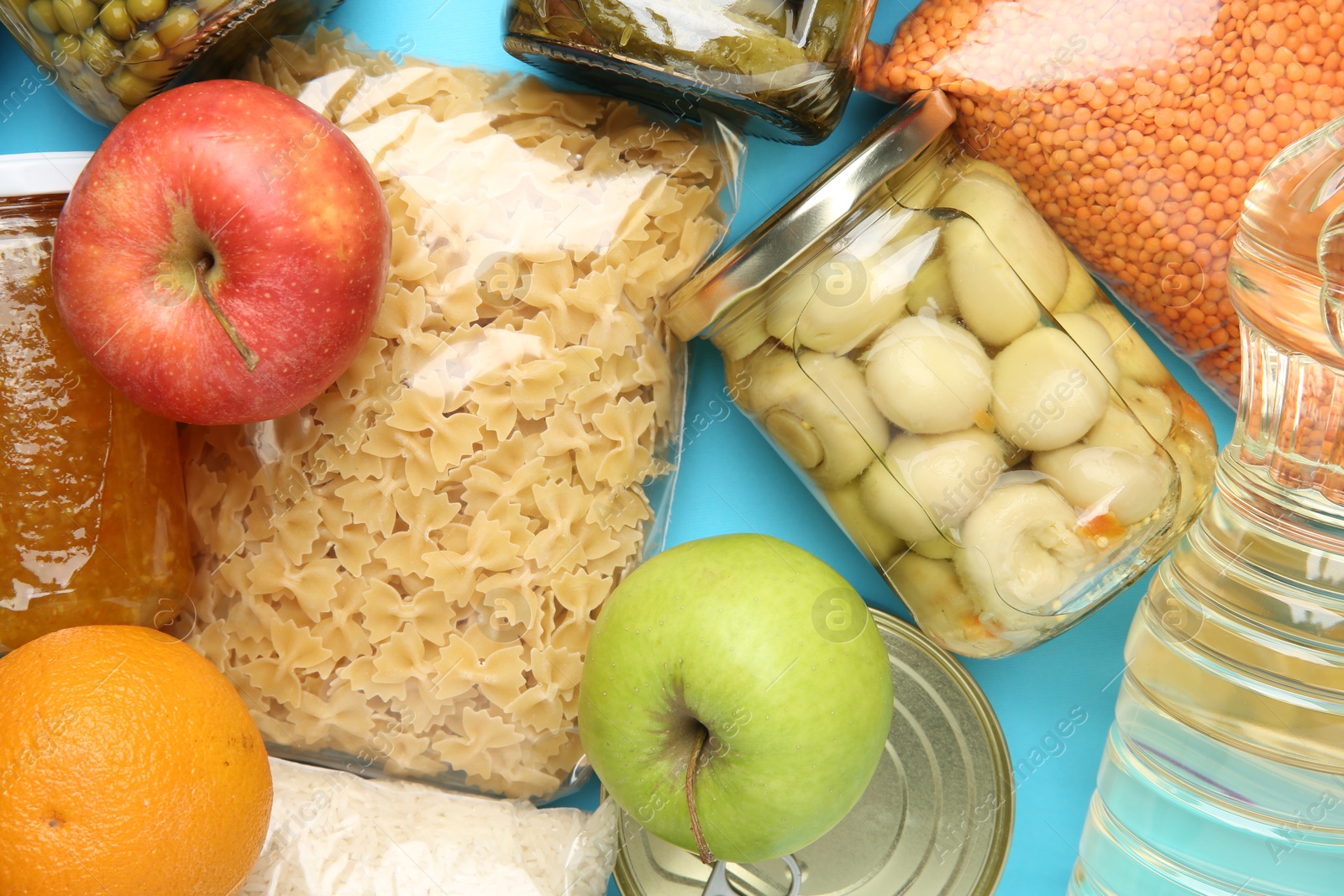 Photo of Food donation. Different products on light blue background, top view