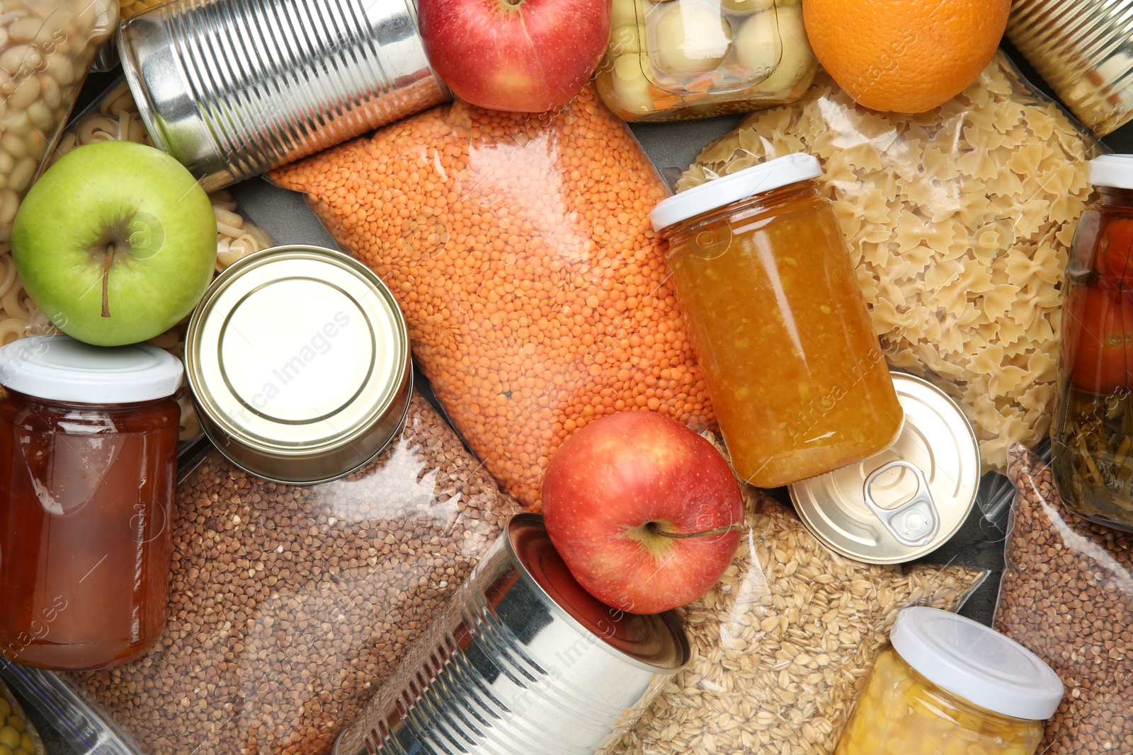 Photo of Food donation. Different products on table, top view