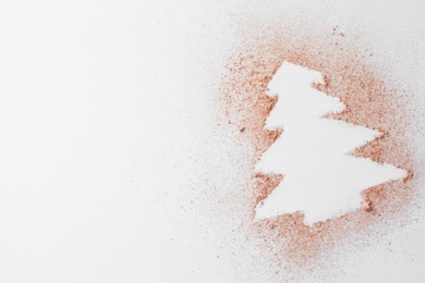 Christmas tree made of powder on white background, top view. Space for text