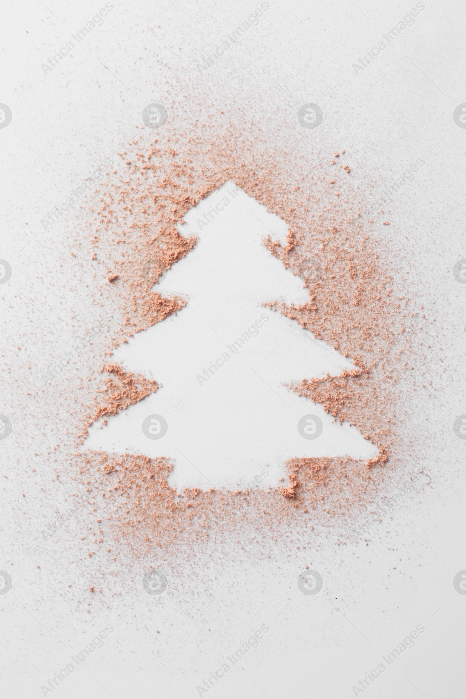 Photo of Christmas tree made of powder on white background, top view