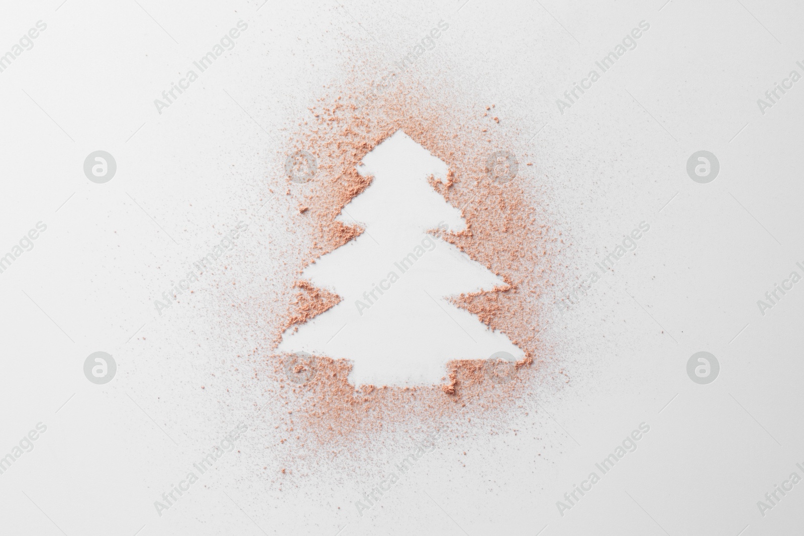 Photo of Christmas tree made of powder on white background, top view