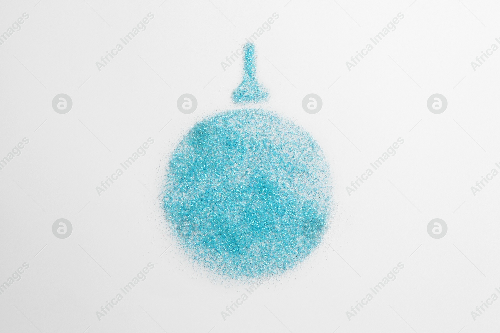 Photo of Christmas ball made of light blue glitter on white background, top view