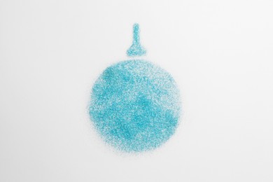 Christmas ball made of light blue glitter on white background, top view