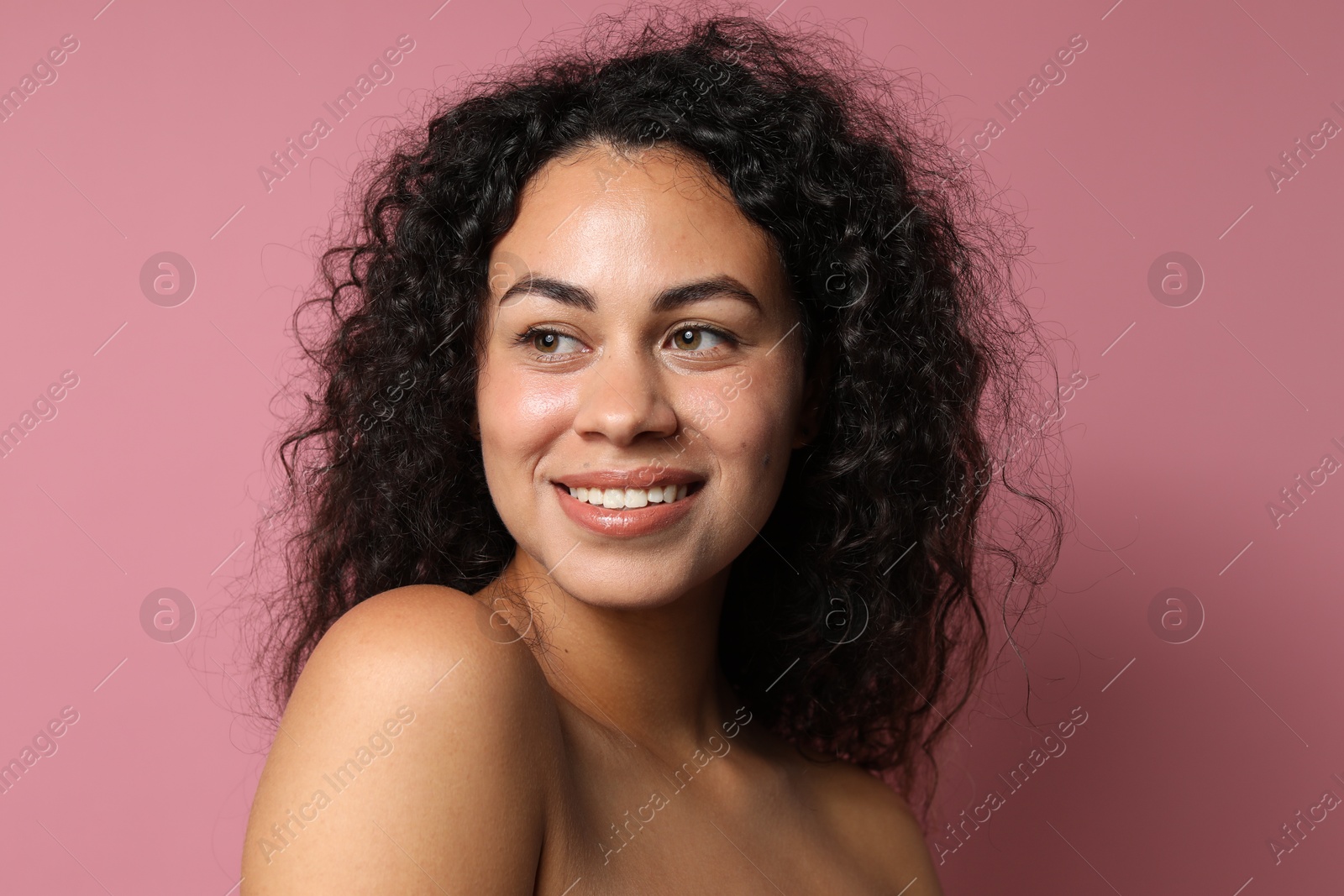 Photo of Cosmetology. Beautiful woman with perfect skin on pink background