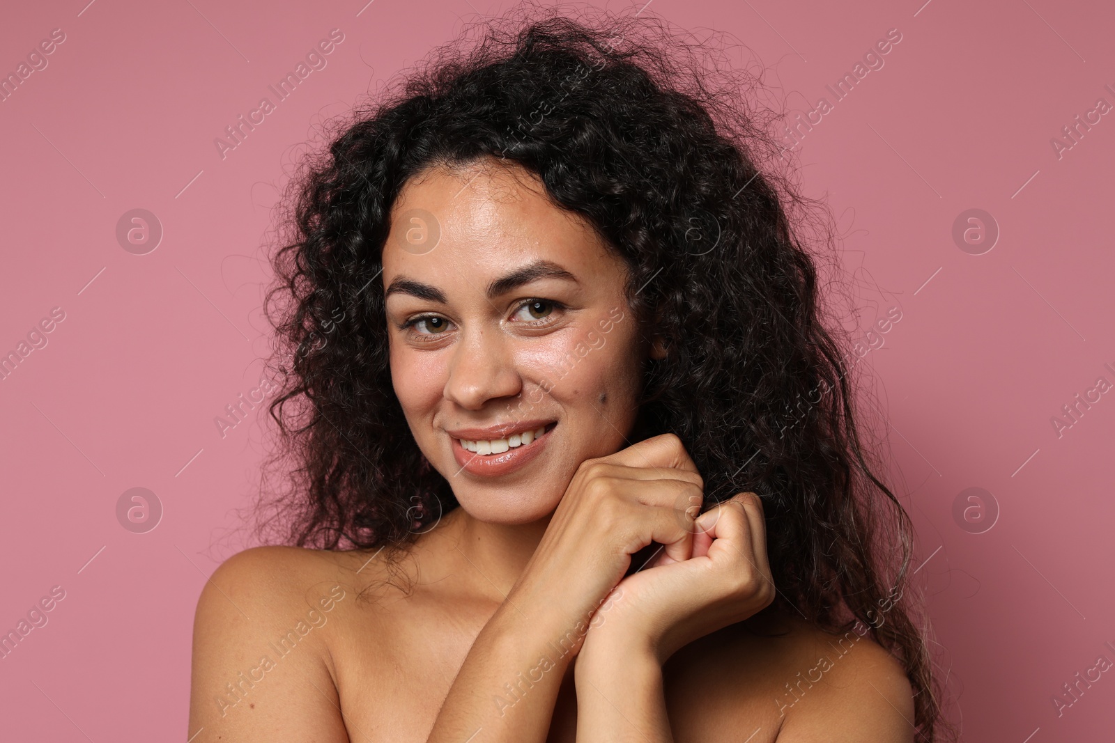 Photo of Cosmetology. Beautiful woman with perfect skin on pink background