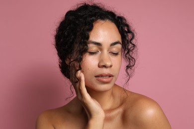 Photo of Cosmetology. Beautiful woman with perfect skin on pink background