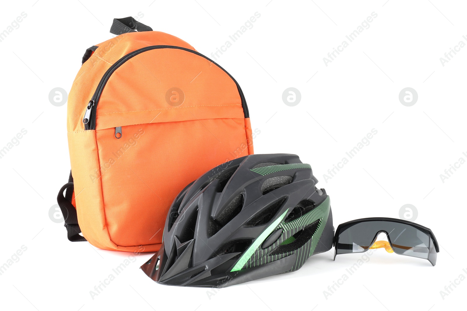 Photo of Bicycle helmet, goggles and backpack isolated on white