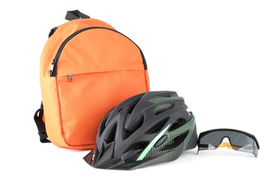 Bicycle helmet, goggles and backpack isolated on white