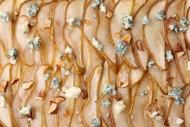 Photo of Delicious puff pastry tart with pears, almond, honey and blue cheese as background, top view