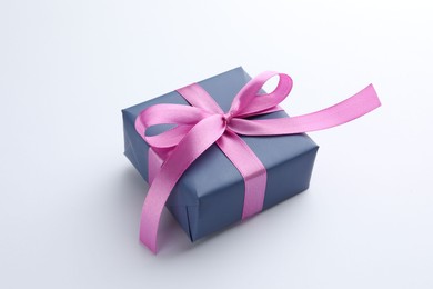 Photo of Beautiful gift box with pink bow isolated on white