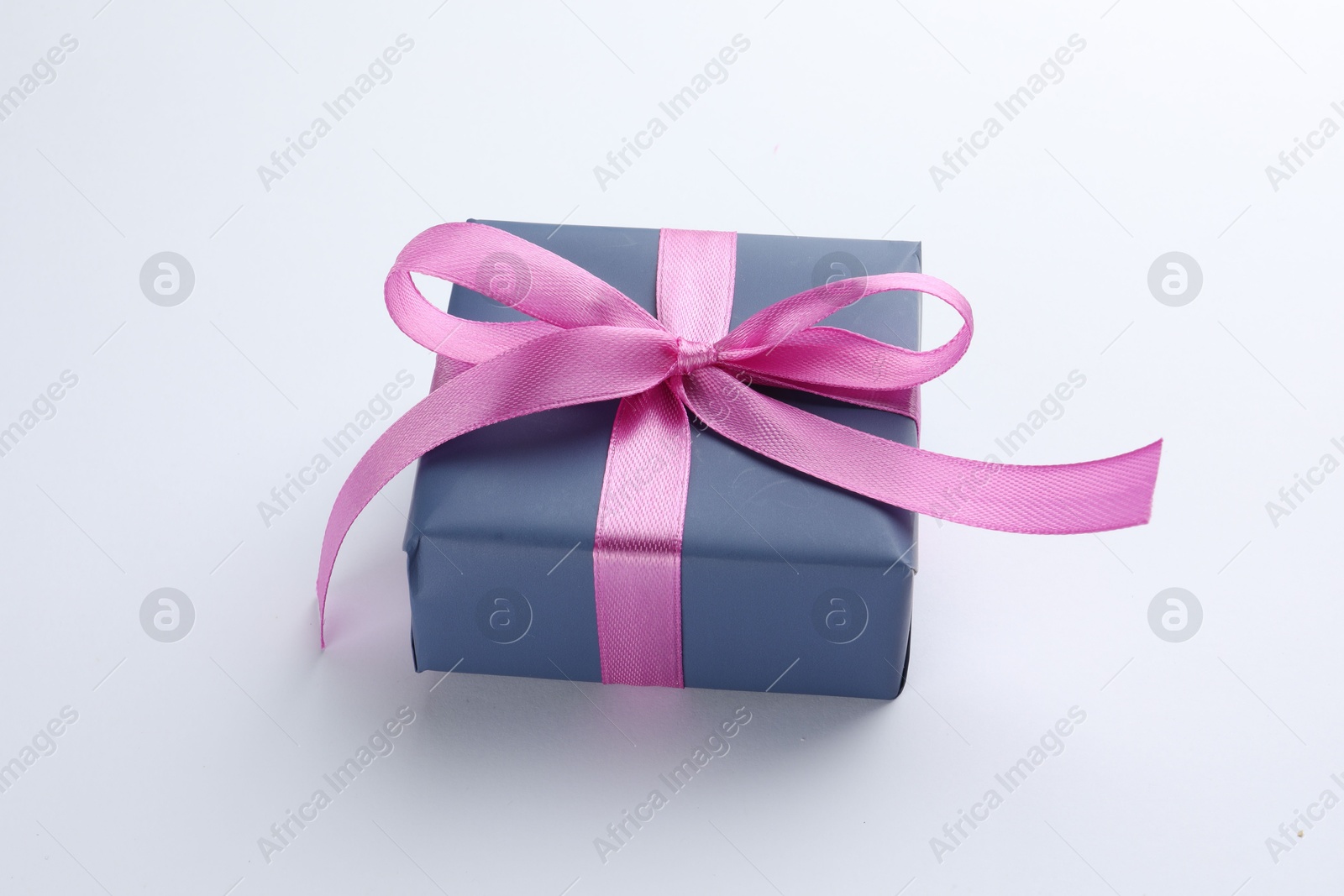 Photo of Beautiful gift box with pink bow isolated on white