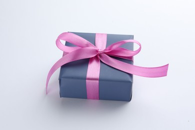 Photo of Beautiful gift box with pink bow isolated on white