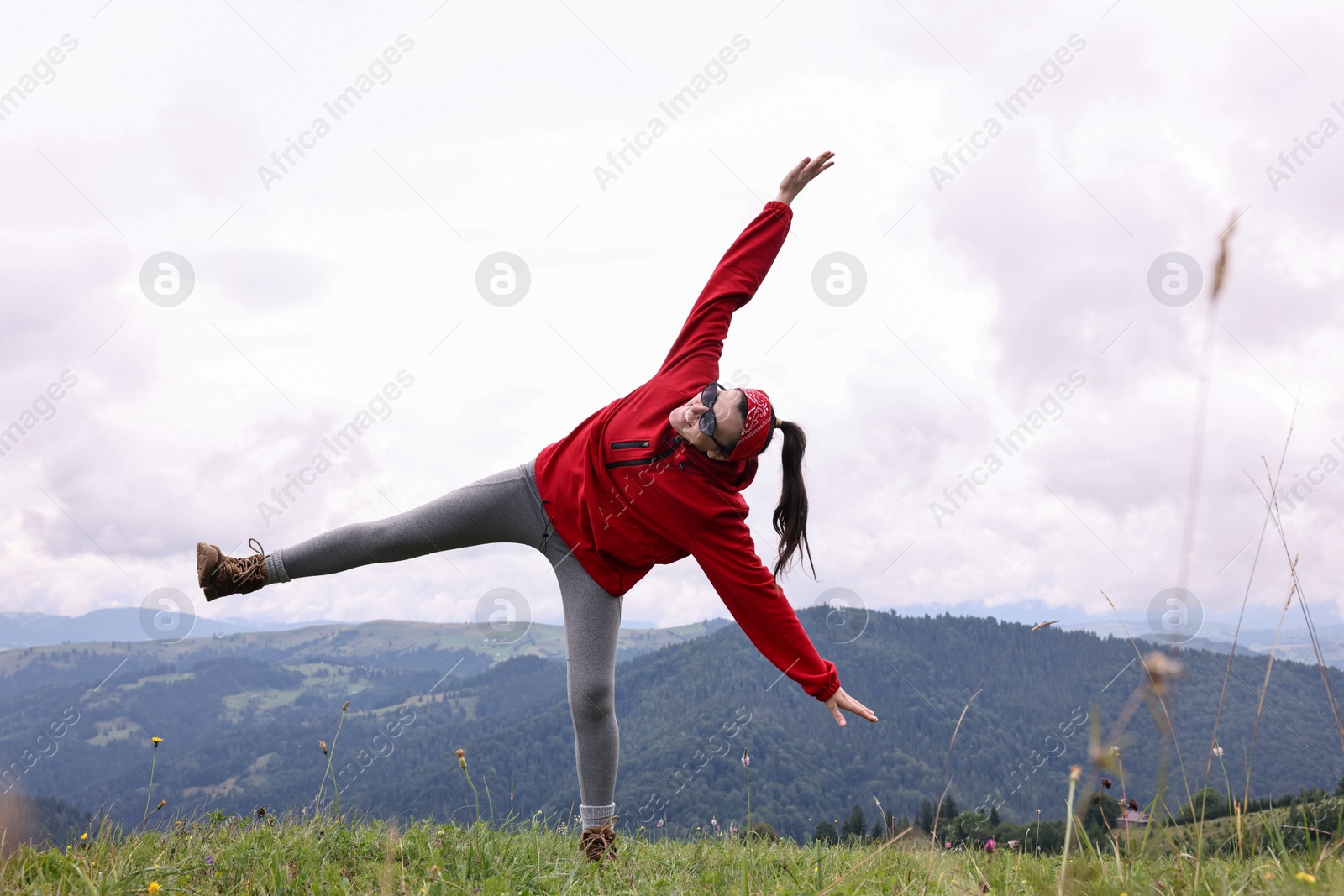 Photo of Happy young hiker in mountains. Active tourism