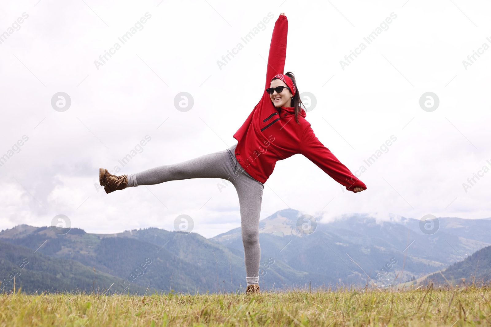 Photo of Happy young hiker in mountains. Active tourism