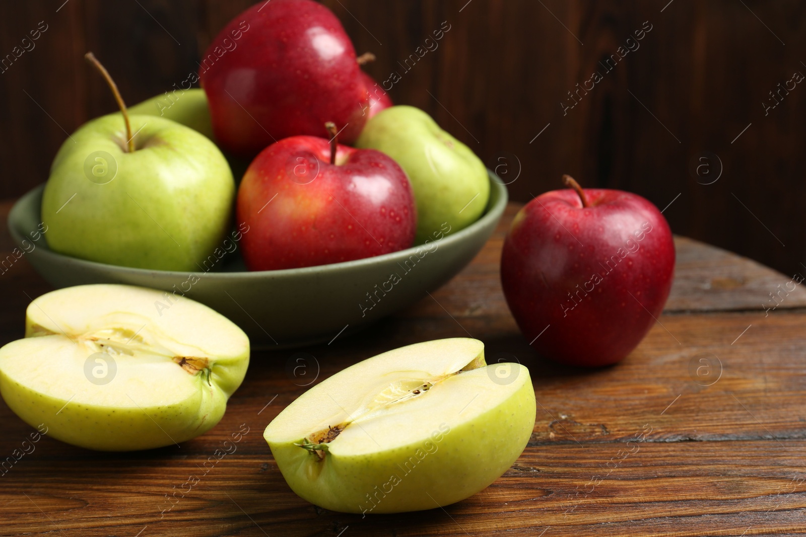 Fresh red and green apples on wooden table Photo of Fresh red and green apples on wooden table